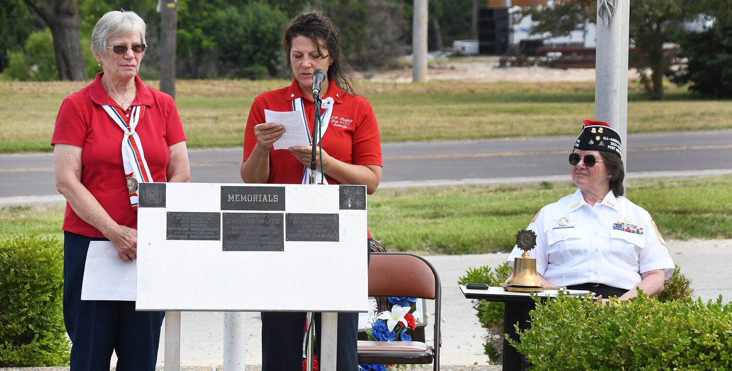 VFW Post No. 6133 Auxiliary members Joyce Baxter (left) and Tina Medlock present the reading for a memorial wreath laying ceremony Monday during the post’s Memorial Day  service. Post member Sandy Harris is pictured on the right.